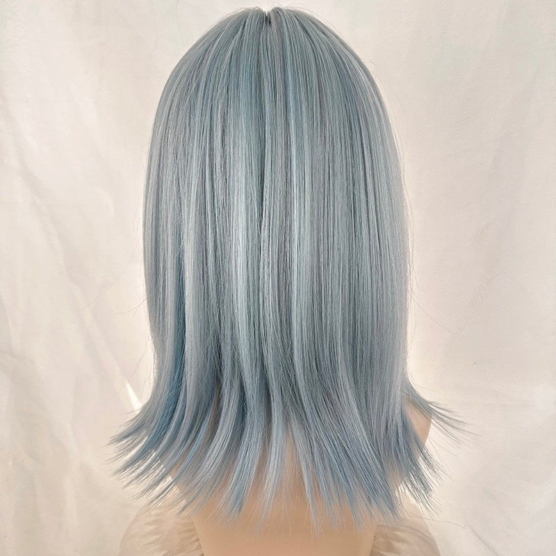 Light blue wig on a mannequin head against a white background