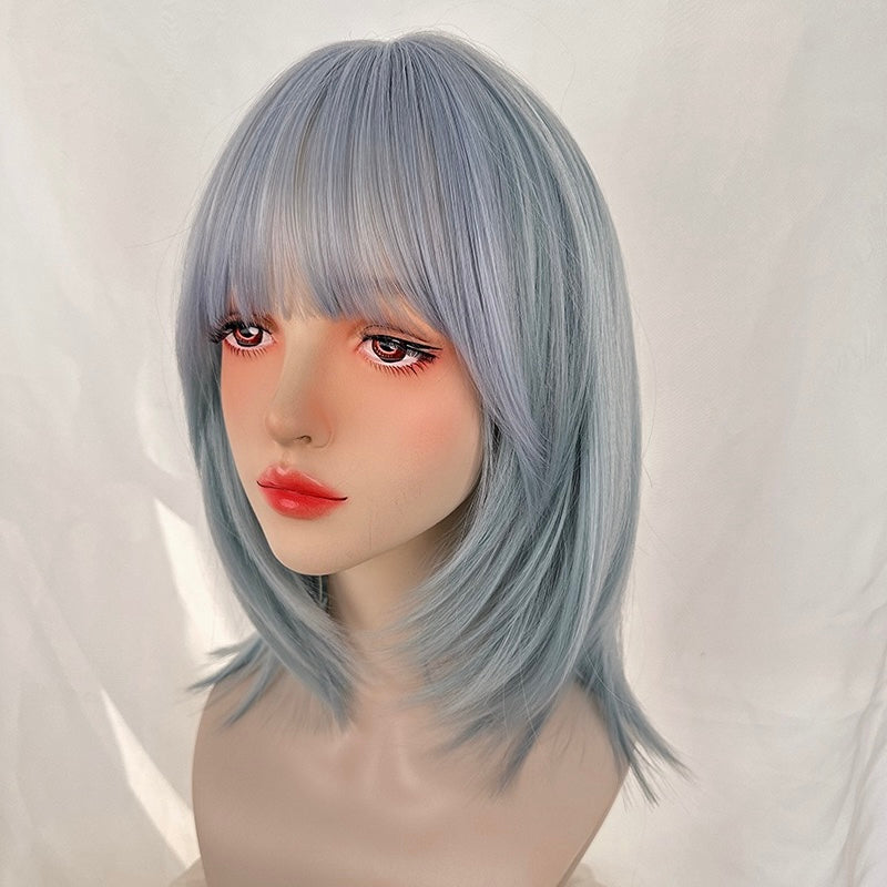 Mannequin head with light blue wig on a white background