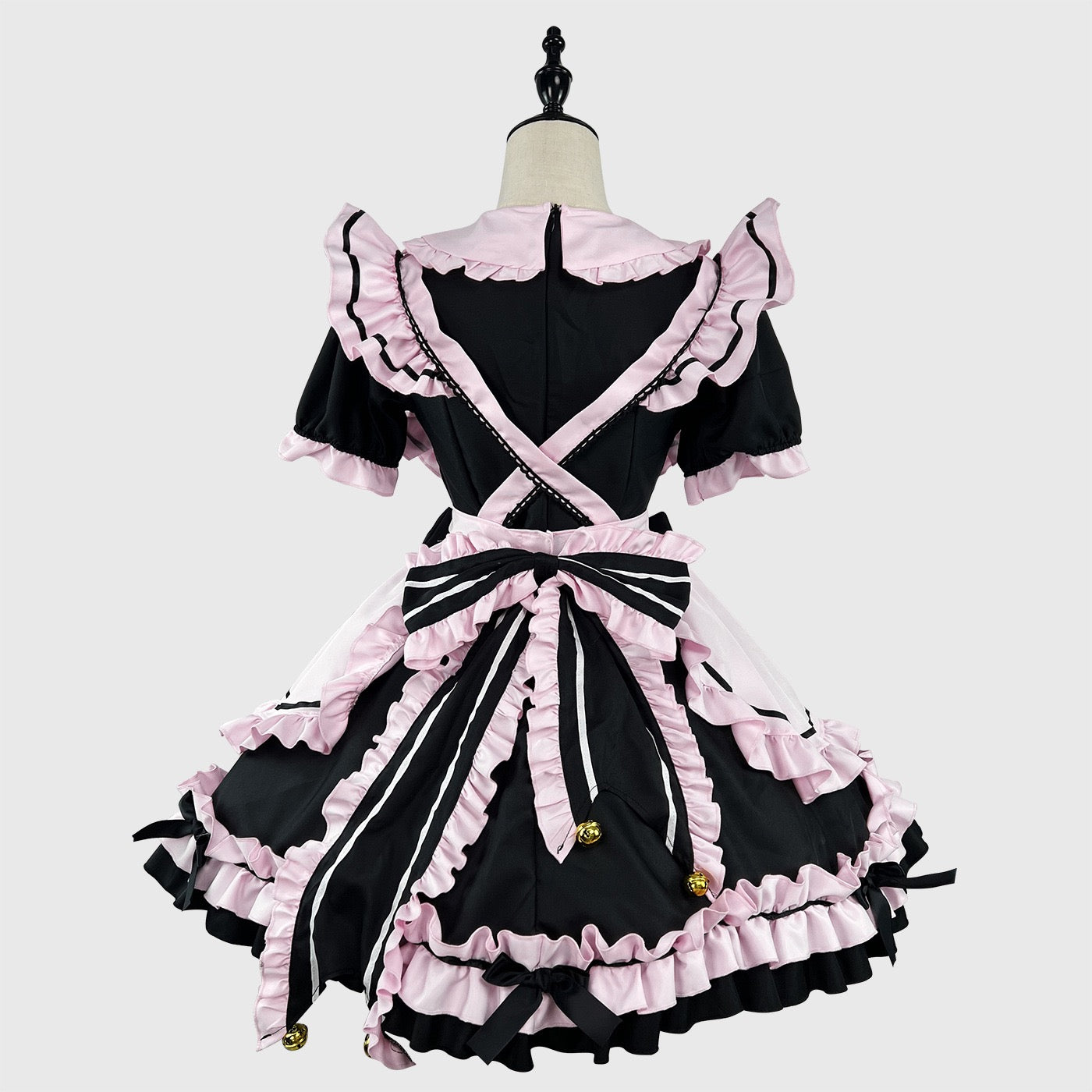 Black and pink maid dress on a mannequin against a white background