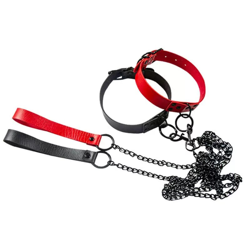 Red and black leather collar with chain on a white background