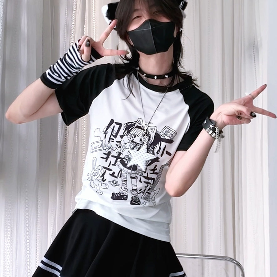 Person wearing a black and white baseball shirt with graphic design, posing against a light curtain background.