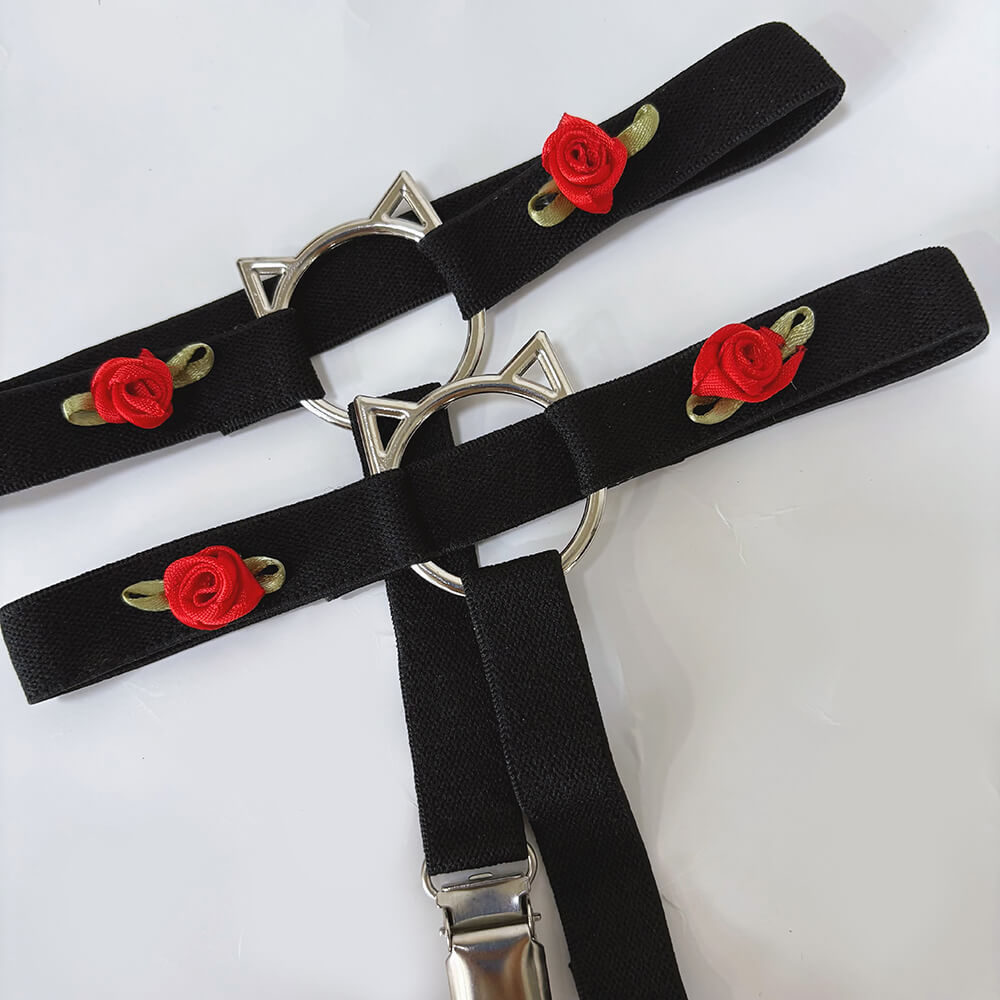 Black garters with red rose embroidery and silver cat-shaped buckles on a white background