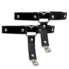 Black leather garters with silver heart designs and metal clasps on a white background