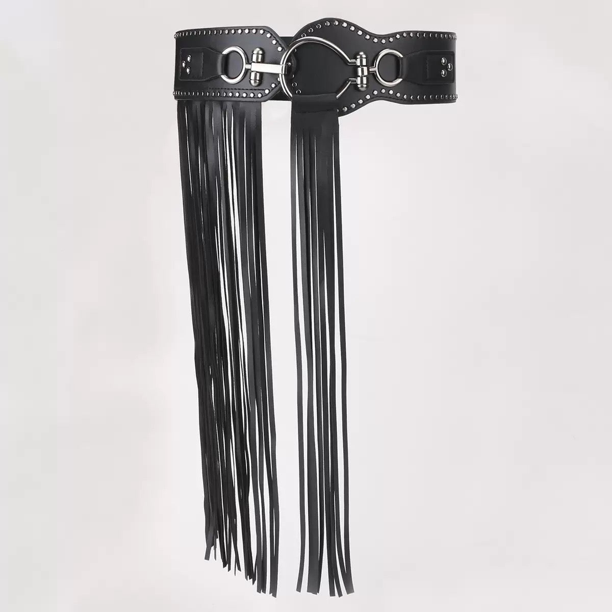 Black leather belt with tassel on a light gray background