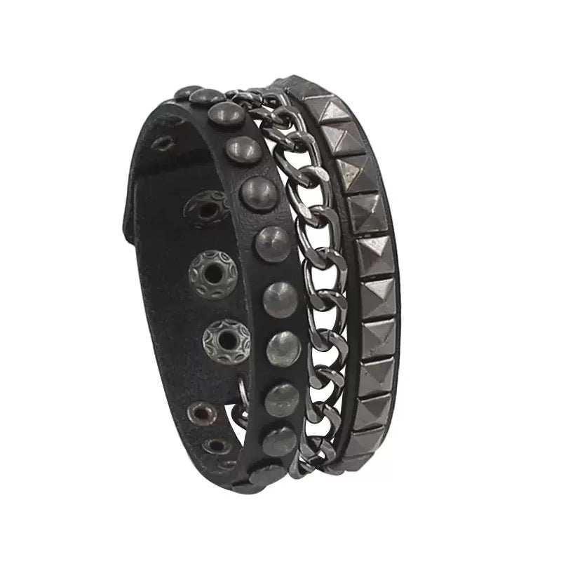 Black leather bracelet with studs and chain on a white background