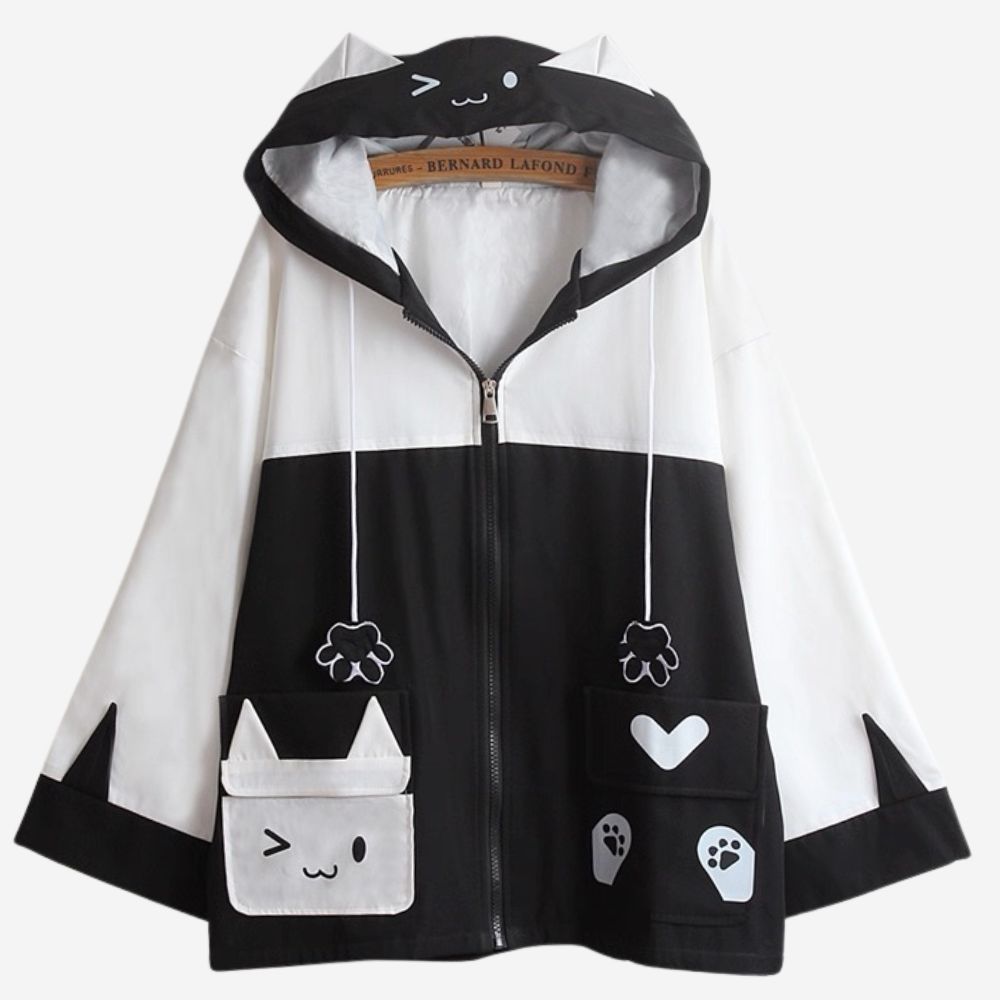 Black and white jacket with cartoon cat design on a white background