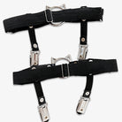 Black leg garters with metal clips on a white background