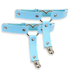 Light blue leather leg garters with metal heart designs on a white background