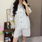 Cute femboy wear a pastel blue striped pajama set