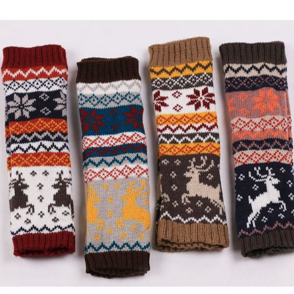 Four pairs of elk fingerless knit arm warmers with festive patterns on a white background