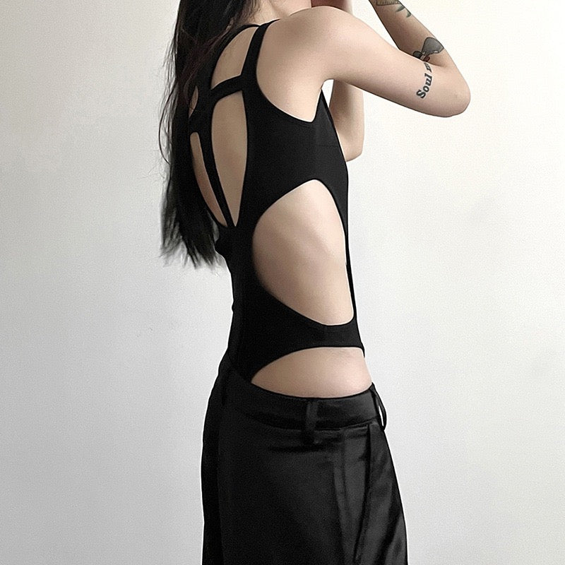 Person wearing a black sexy black hollow out sleeveless bodysuit