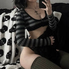 Femboy in black and grey striped long sleeve crop