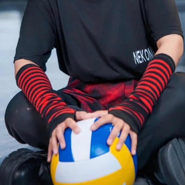 femboy-in-black and red striped arm warmers