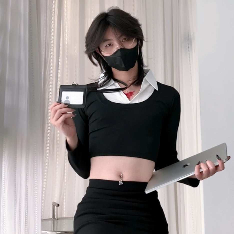 Femboy wearing a black mask and holding a laptop and ID card against a neutral background