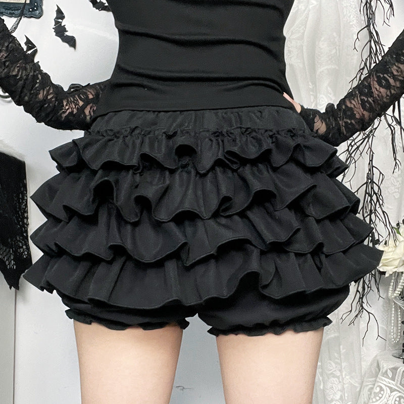 Femboy in gothic black multi layered skirt with crosses back