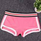 Pink boyshort underwear with a striped waistband on a gray surface.