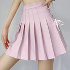 Femboy wear a pink lace up side pleated skirt