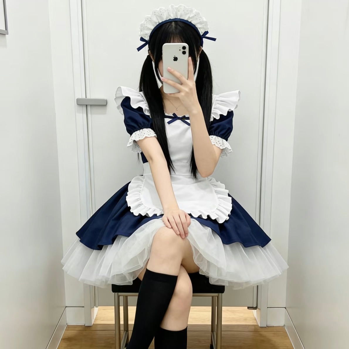 Femboy in a navy cosplay lolita maid dress