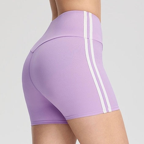 Femboy wearing a black and red two-tone skirt on a plain background