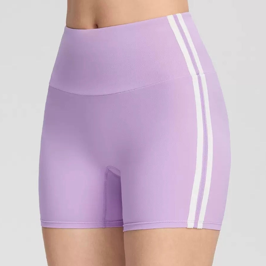 Black and red athletic femboy yoga shorts on a plain background