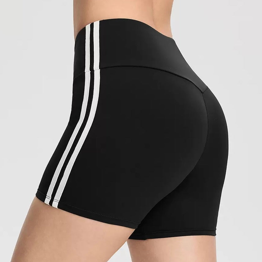 Black and white athletic femboy yoga shorts on a neutral background