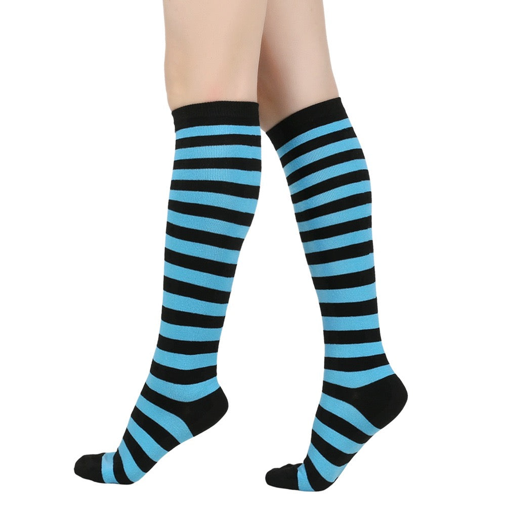 Black and blue femboy pin striped knee-high socks on a white background