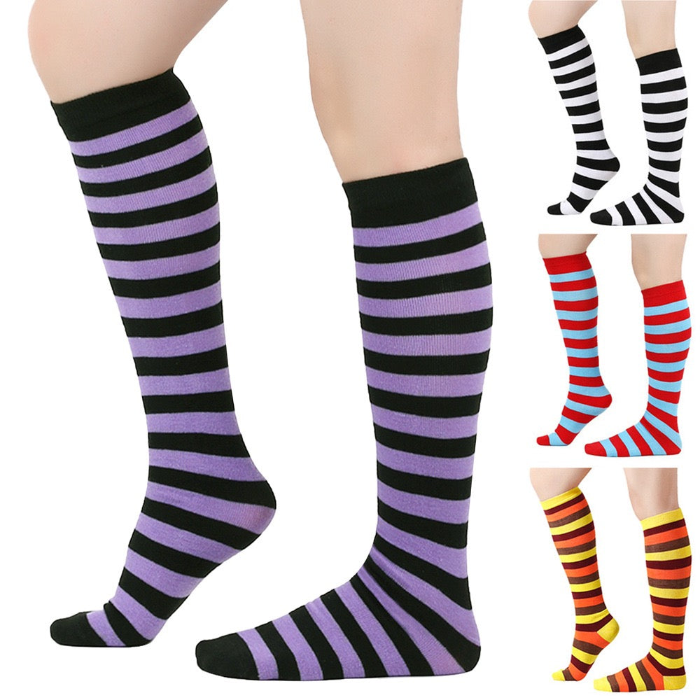 Striped knee-high socks in black, purple, red, and yellow on a white background.