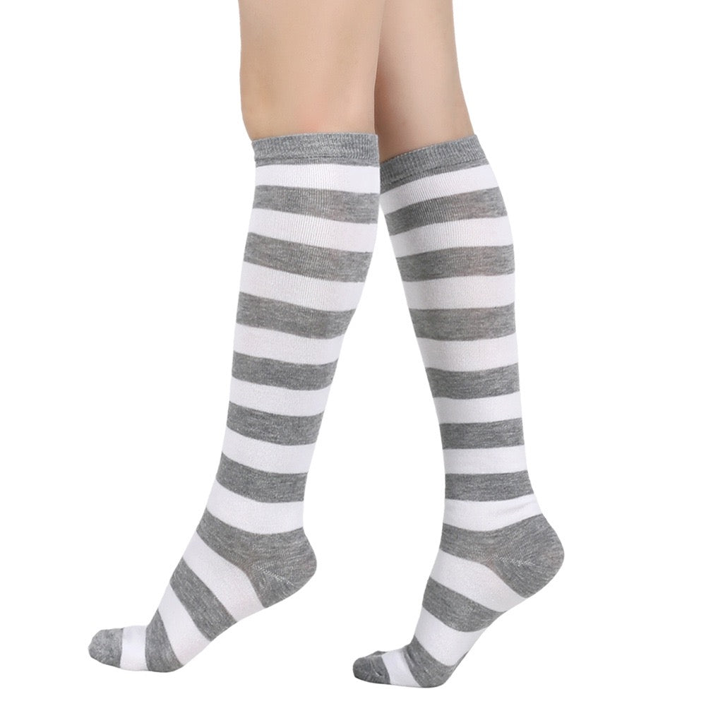 Gray and white femboy striped knee-high socks on a white background