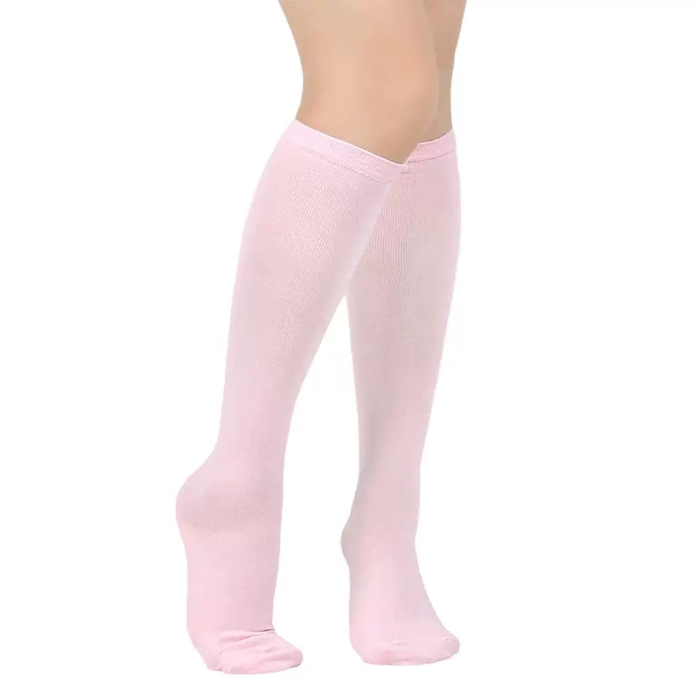 Pink knee-high socks on a white background