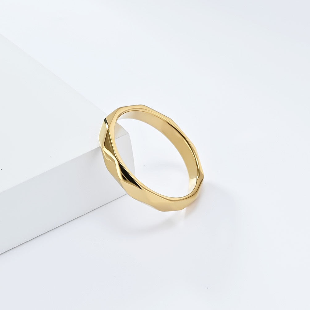 Gold minimalist rhombus stainless steel ring band on a white background