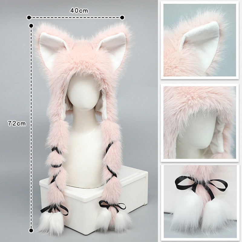 Pink fluffy fox hat with measurements on a gray background