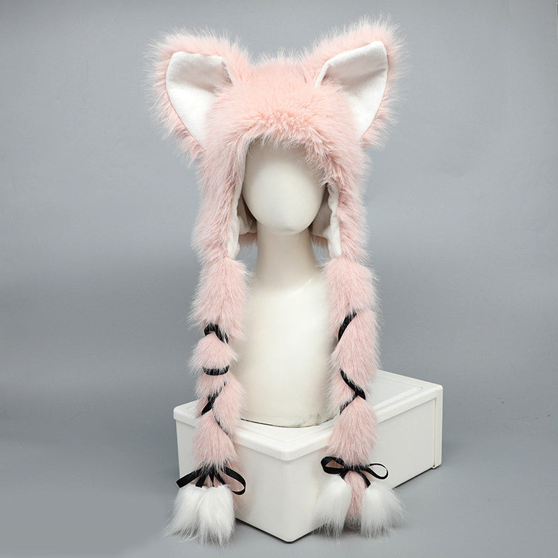 Pink furry hat with cat ears on a mannequin head against a gray background