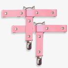 Pink leg garters with cat ear designs on a white background