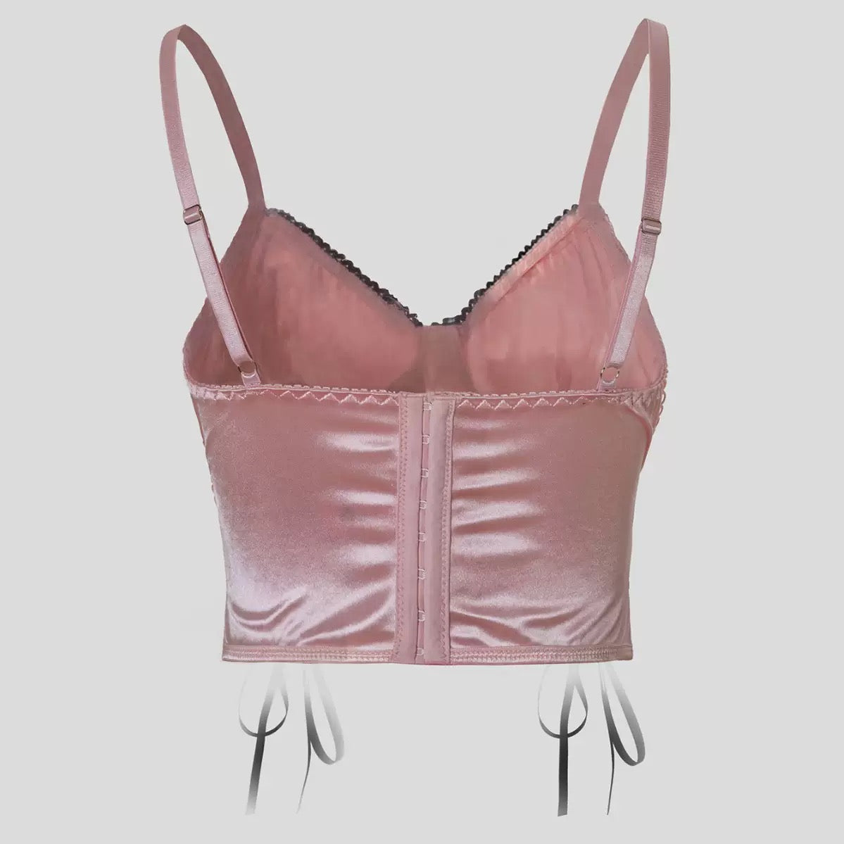 Pink satin bralette on a mannequin against a light gray background