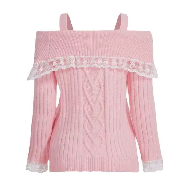 A pink ribbed knit cold-shoulder sweater with white lace trim across the neckline and cuffs, displayed on a solid white background.