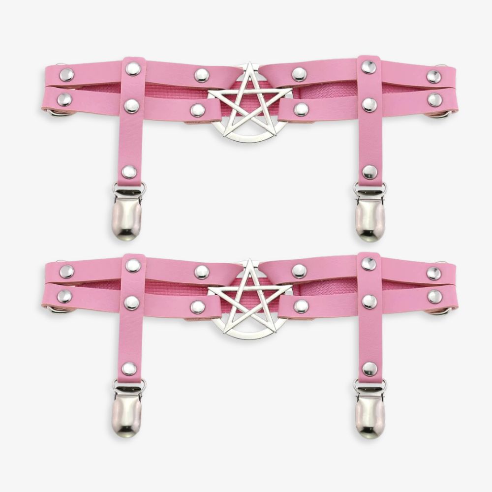 Pink leather leg garters with silver pentagram design on a white background