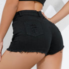 Black denim shorts worn by a person on a white background