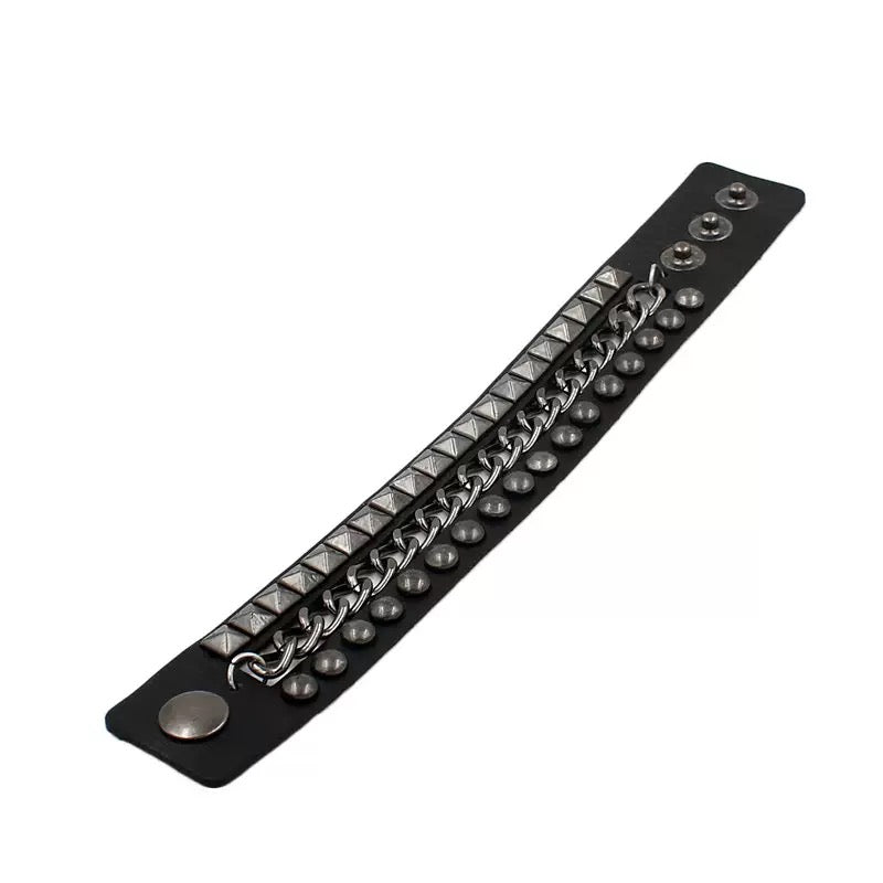 Black leather bracelet with metal chain and studs on a white background