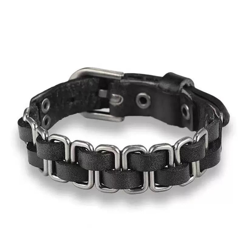 Black leather and metal bracelet on a white background