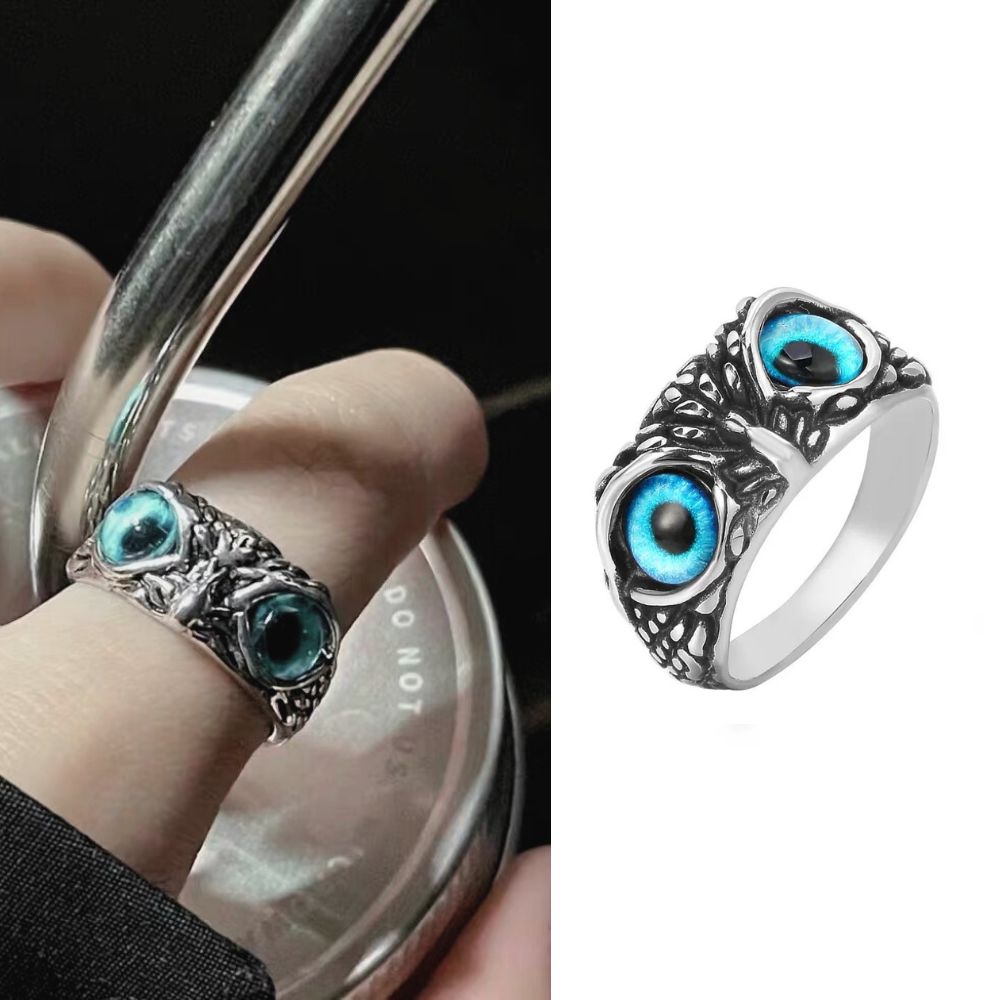 Silver ring with blue gemstones worn on a finger, next to a close-up of the ring on a white background.