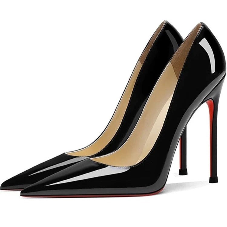 Black high-heeled shoes with a red sole on a white background