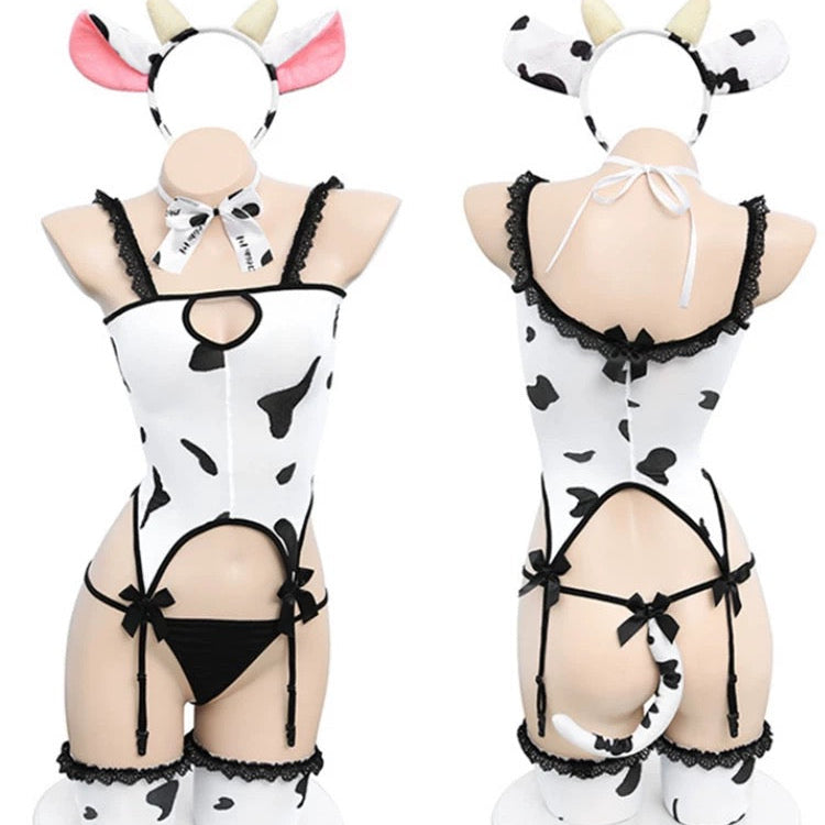 Cow print lingerie set on mannequins with cow headbands.