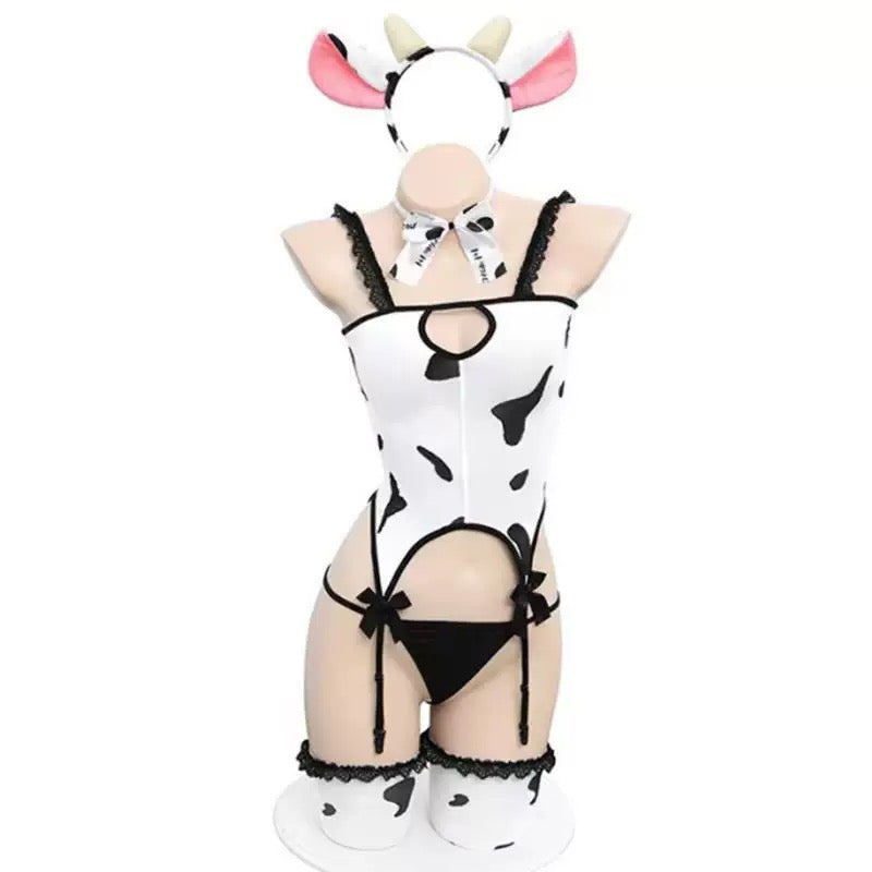 Cow print bodystocking lingerie set on a mannequin with a white background