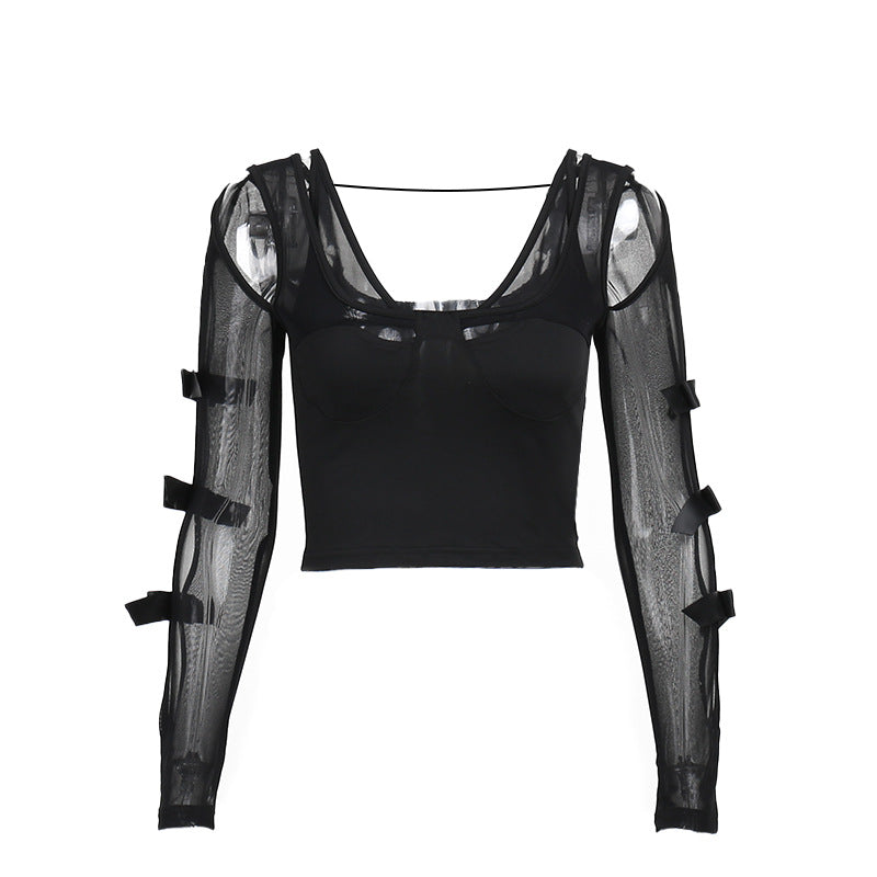 Black top with sheer sleeves and black bows on a white background