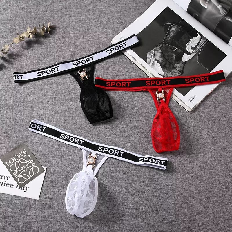 Three pairs of garters with 'SPORT' branding on a gray surface.
