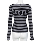 Black and gray striped sweater on a mannequin against a white background