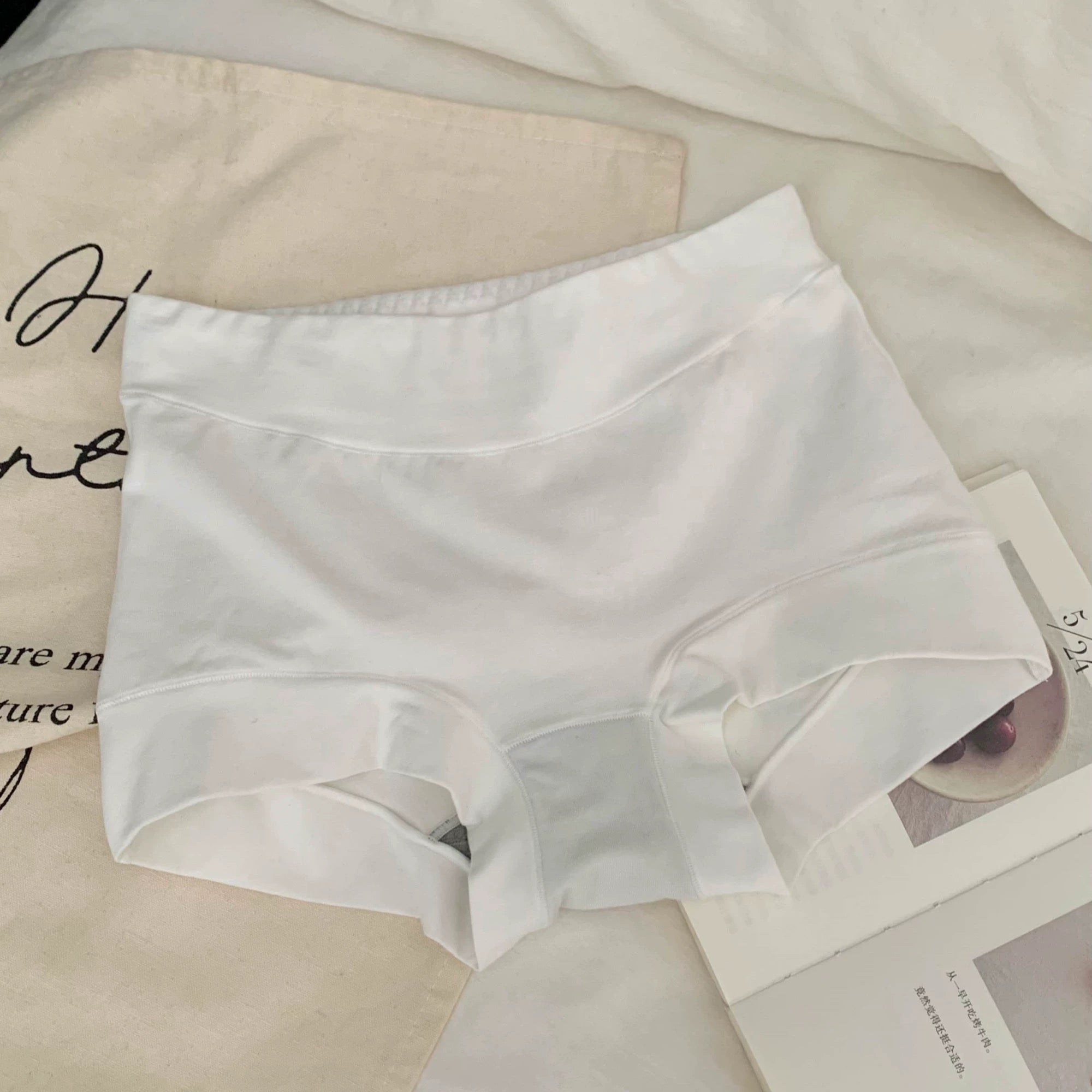 White cotton boyshorts on a light background