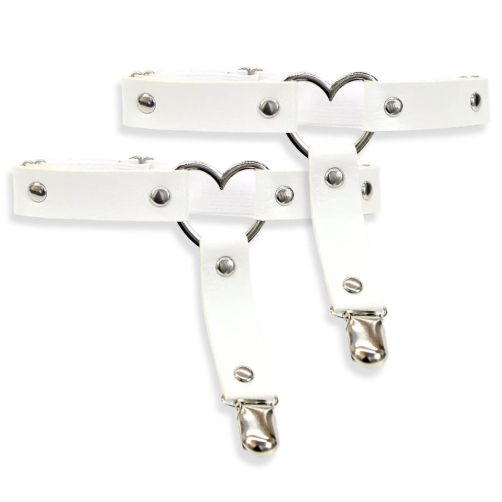 White leather garters with metal hardware on a white background