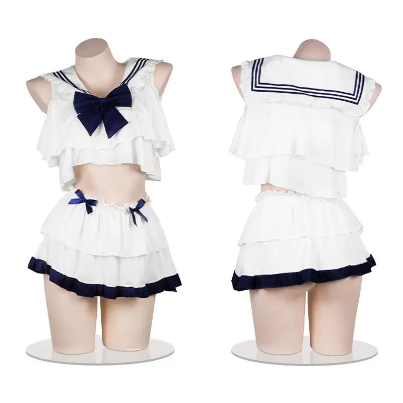 White sailor lingerie set with blue and black trim on a mannequin against a white background