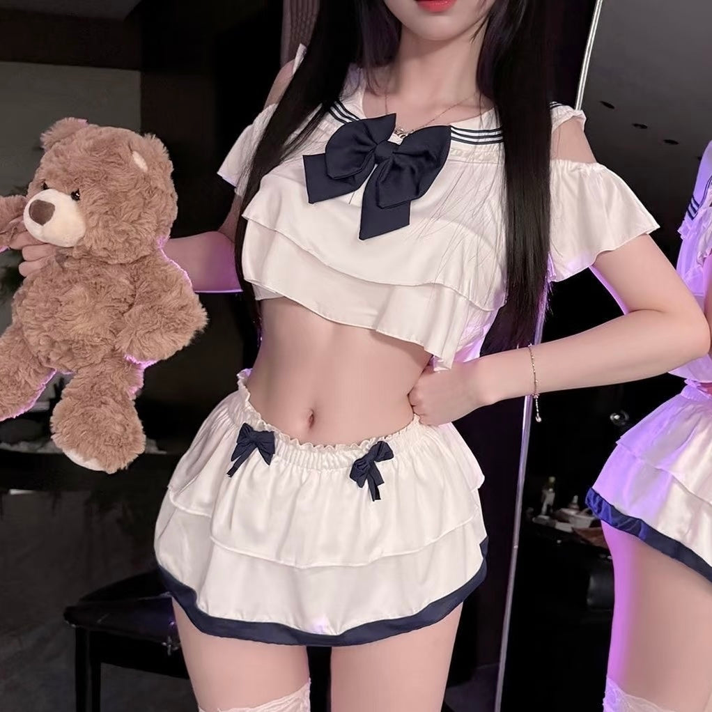 White sailor lingerie set with black and blue accents on a mannequin against a plain background